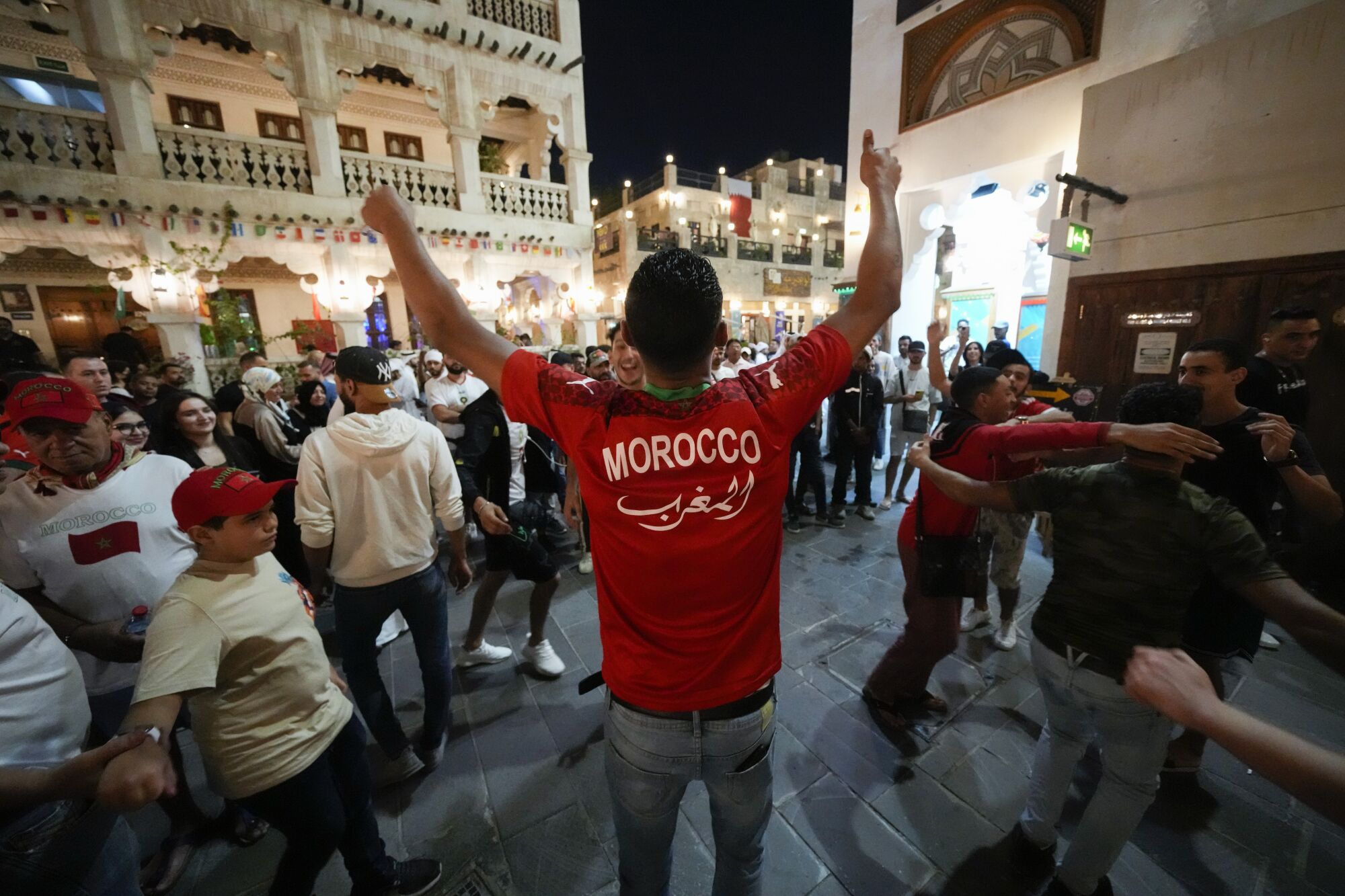 Moroccan soccer fans dance at the S