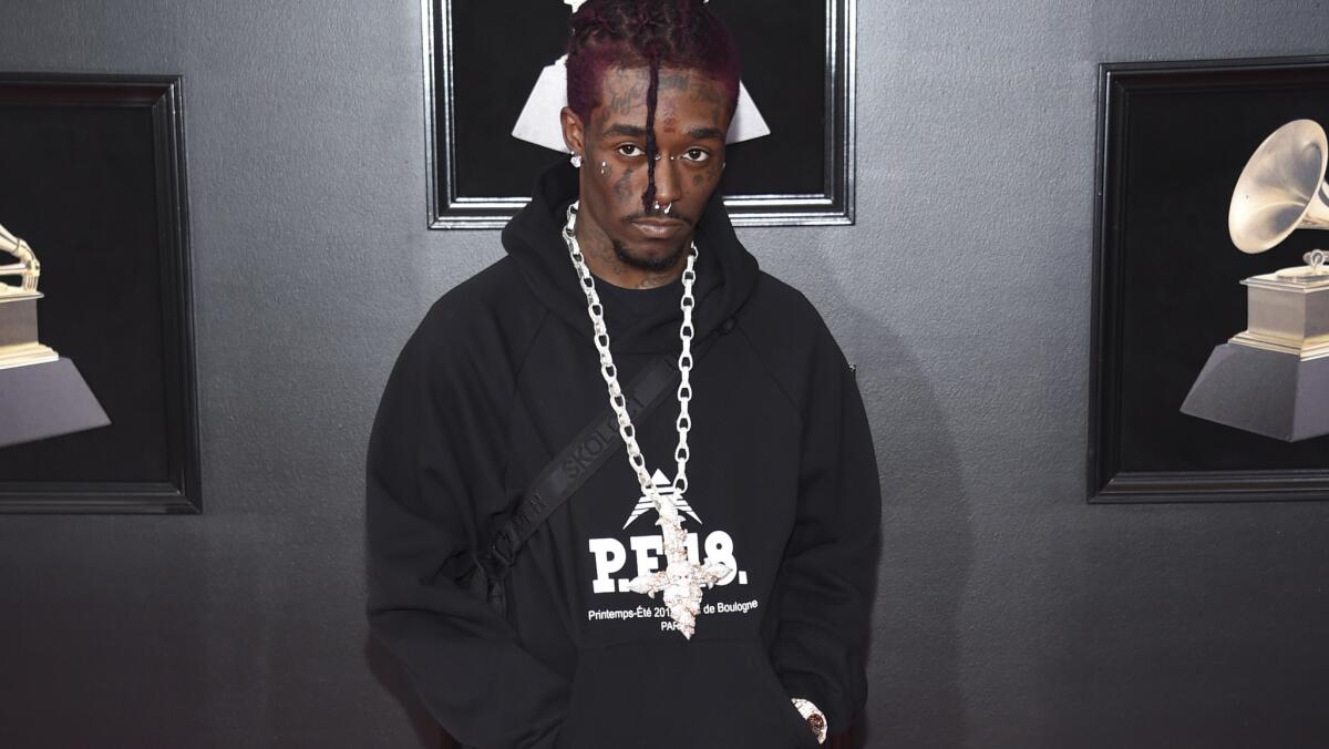 Lil Uzi Vert poses on the Grammys red carpet