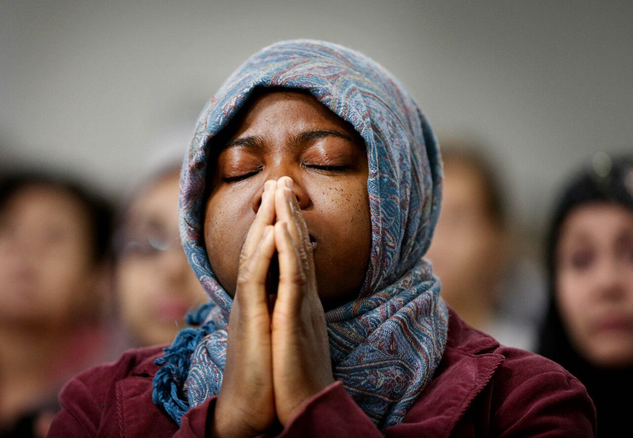 Ajarat Bada prays during a memorial service at the Islamic Community Center of Redlands in Loma Linda to remember the victims of the San Bernardino shooting rampage.
