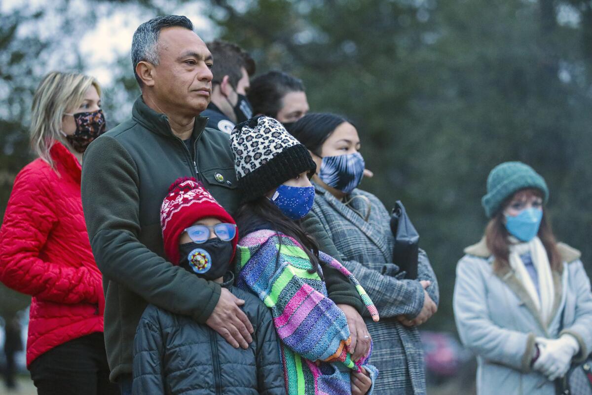 Miguel Luna and his daughters attend a Native American winter solstice prayer ceremony.