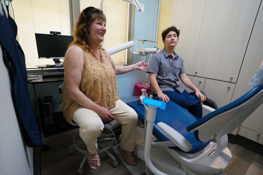San Diego, CA - August 23: On Tuesday, Aug. 23, 2022 in San Diego, CA., at Father Joe's Villages dental office, Danna Adair, 60 and her son Randy Payne, 15, shared their experience on the dental care they received at the facility. (Nelvin C. Cepeda / The San Diego Union-Tribune)