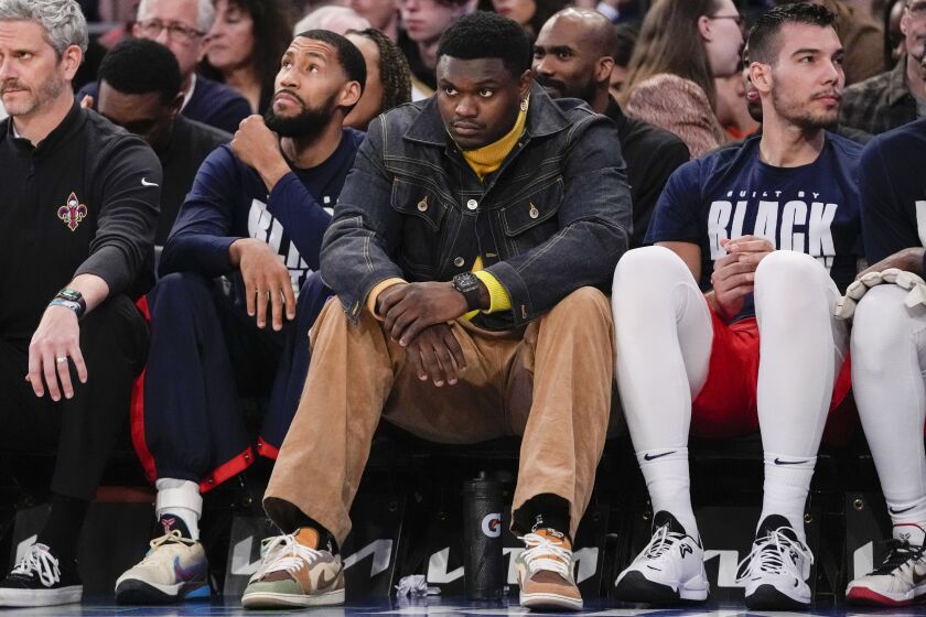 New Orleans Pelicans forward Zion Williamson, center watches from the bench during the second half of an NBA basketball game against the New York Knicks, Saturday, Feb. 25, 2023, at Madison Square Garden in New York. (AP Photo/Mary Altaffer)