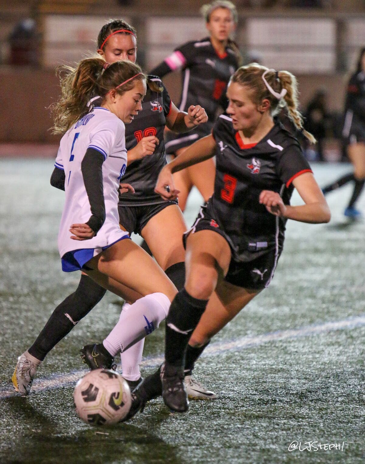 Vikings (in black) fight for the ball during a recent La Jolla High School soccer match.