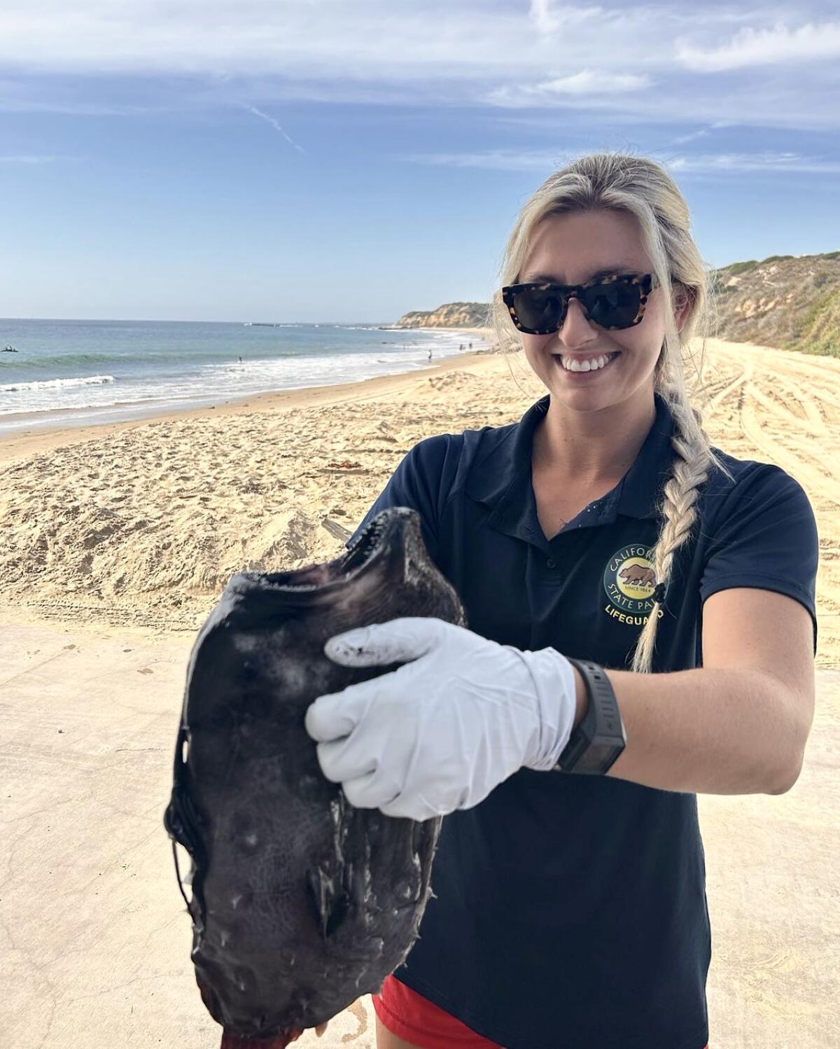 Seasonal lifeguard Sierra Fockler discovered a 14-inch Pacific football fish at Crystal Cove State Park.