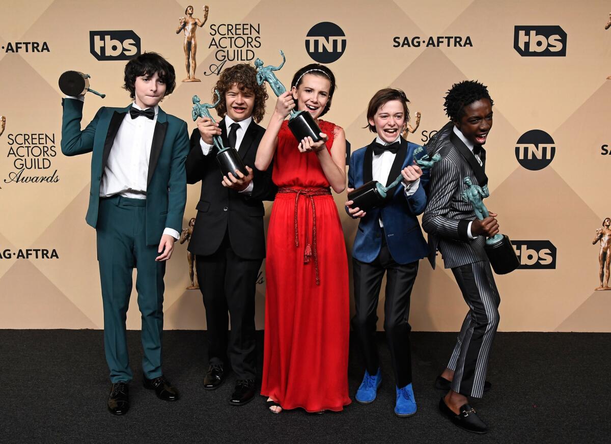 Actors Finn Wolfhard, Gaten Matarazzo, Millie Bobby Brown, Noah Schnapp, and Caleb McLaughlin, co-recipients of the Outstanding Performance by an Ensemble in a Drama Series award for 'Stranger Things,' pose in the press room during The 23rd Annual Screen Actors Guild Awards at The Shrine Auditorium on January 29, 2017 in Los Angeles, California. 26592_008 (Photo by Frazer Harrison/Getty Images) ** OUTS - ELSENT, FPG, CM - OUTS * NM, PH, VA if sourced by CT, LA or MoD **