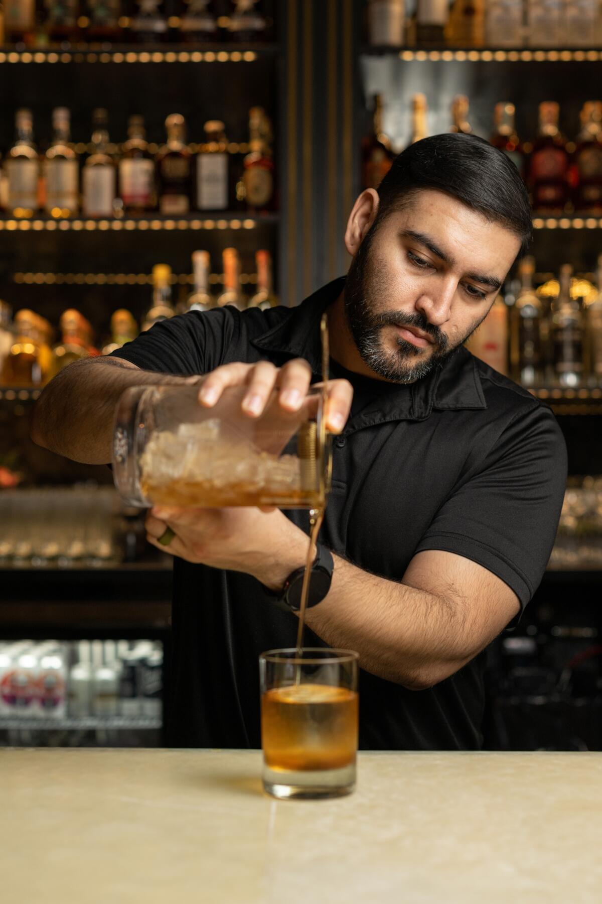 Julian Flores Torres behind the bar at Union Social.