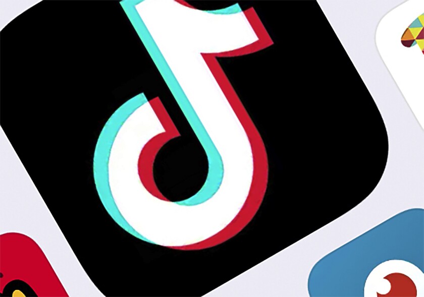 The icon for TikTok is on a touch screen