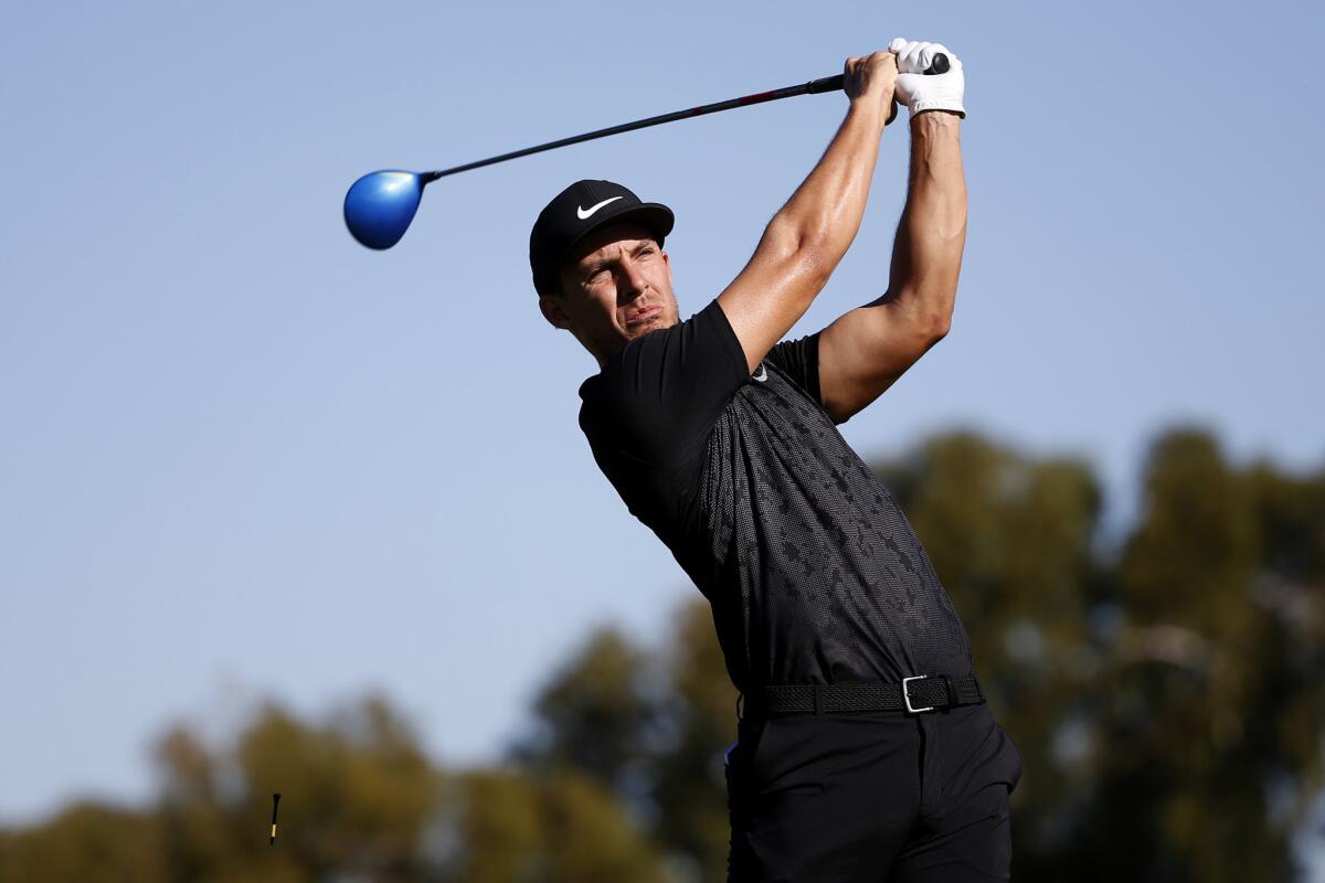 Jamie Lovemark tees off on the second hole during the first round of the Farmers Insurance Open at Torrey Pines.