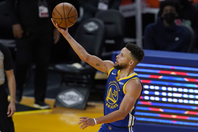 Golden State Warriors guard Stephen Curry (30) shoots against the Cleveland Cavaliers during the second half of an NBA basketball game in San Francisco, Monday, Feb. 15, 2021. (AP Photo/Jeff Chiu)