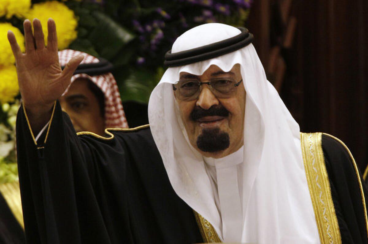 King Abdullah of Saudi Arabia, seen in 2009, waves to members of the Saudi Shura Council in Riyadh, Saudi Arabia.