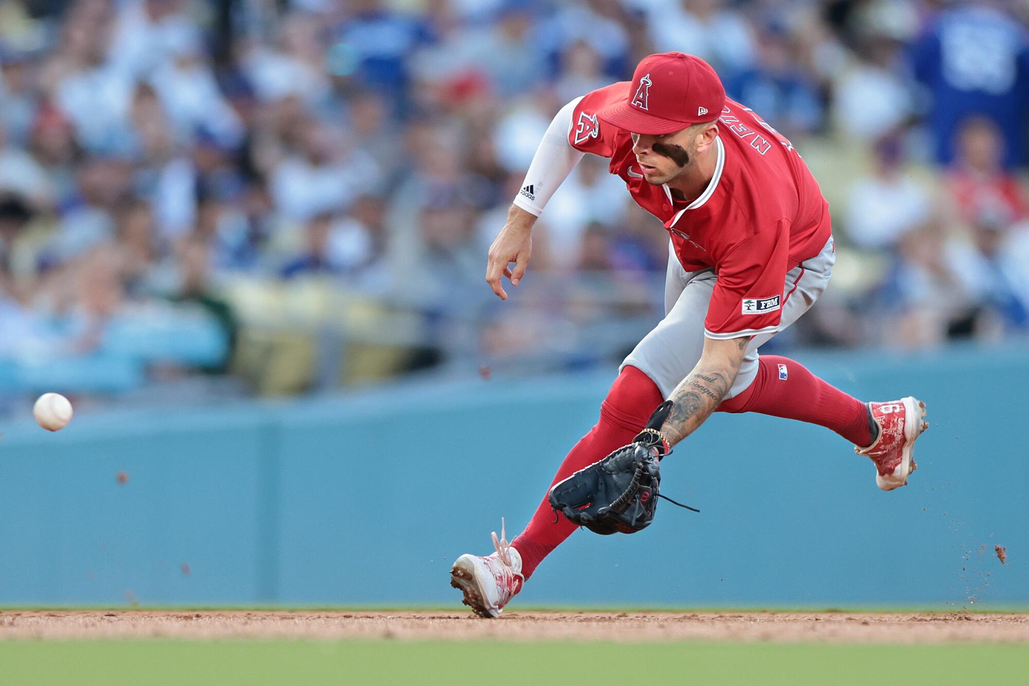 Angels shortstop Zach Neto fields a ball during a 3-2 win over the Dodgers on Friday night.