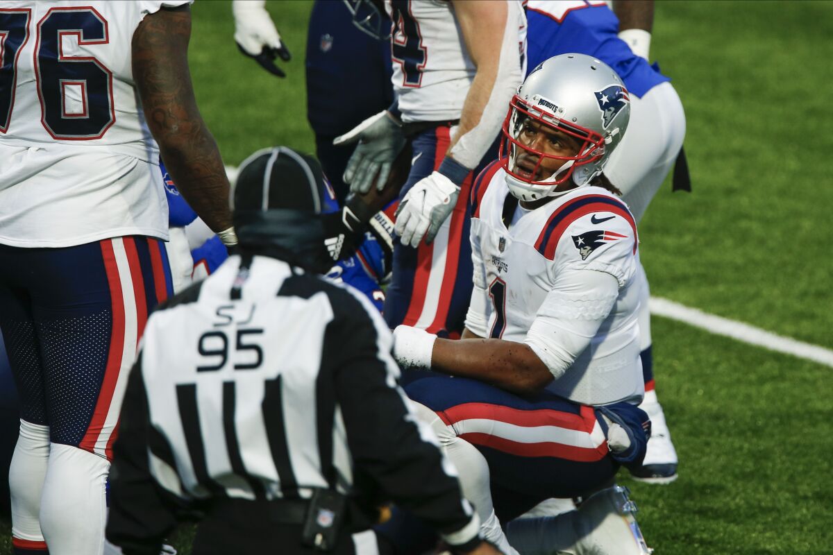 New England Patriots quarterback Cam Newton (1) reacts after fumbling the ball during the final drive of second half of an NFL football game against the Buffalo Bills Sunday, Nov. 1, 2020, in Orchard Park, N.Y. The ball was recovered by Dean Marlowe as the Bills won 24-21. (AP Photo/John Munson)