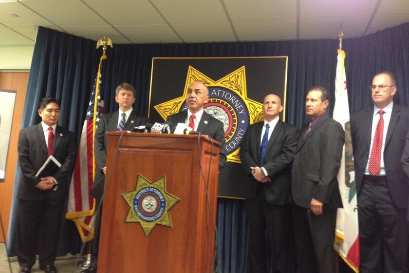 San Bernardino County Dist. Atty. Michael Ramos announces charges against two men associated with the airport authority.