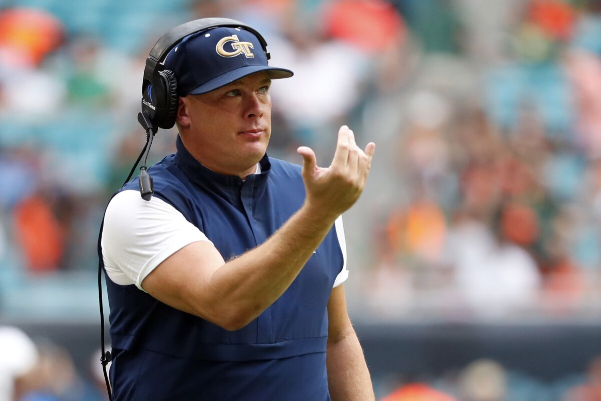 FILE - In this Oct. 19, 2019, file photo, Georgia Tech head coach Geoff Collins gestures during the first half of an NCAA college football game against Miami in Miami Gardens, Fla. With doubts still hanging over the season because of the coronavirus pandemic, Georgia Tech begins practice for Year 2 under coach Geoff Collins. (AP Photo/Wilfredo Lee, File)