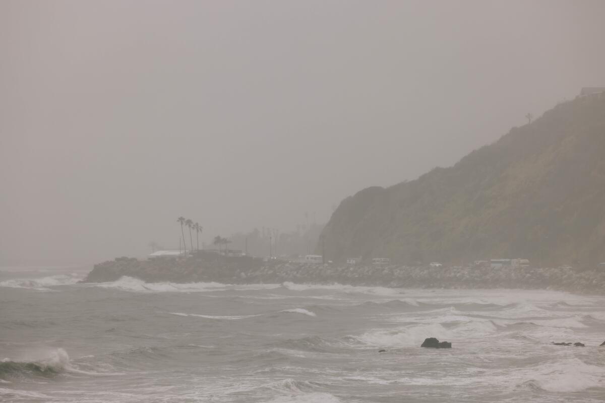 Rain is seen along the coast on Sunday in Malibu.