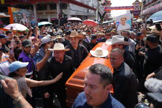 A crowd in Uruapan, Mexico, mourns Mayor Carlos Manzo, who was fatally shot during a Day of the Dead celebration in the city.