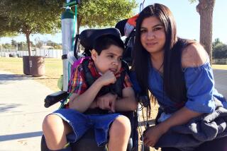 Izaiah Wallis, 10, of Vista, enjoys the sunshine with his mother, Lucy Verde, 30, at Sunset Park in San Marcos on Sunday, Nov. 3.