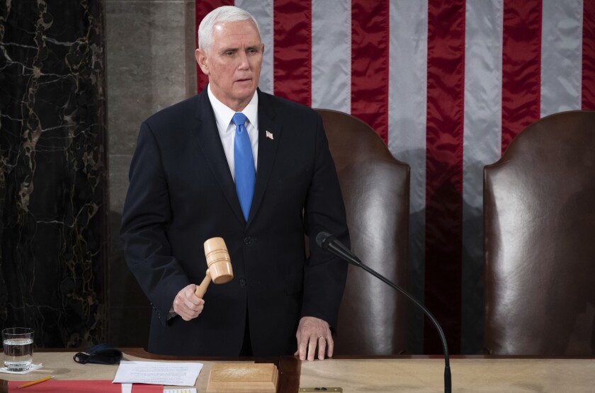 Vice President Mike Pence officiates as a joint session of Congress convenes to confirm Joe Biden's victory on Jan. 6, 2021. 