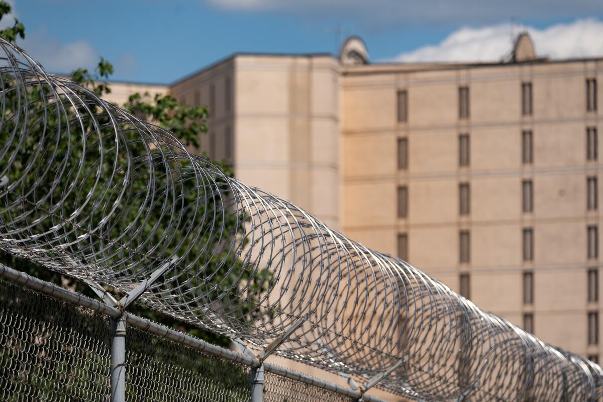 A fence topped with razor wire around the Fulton County Jail.