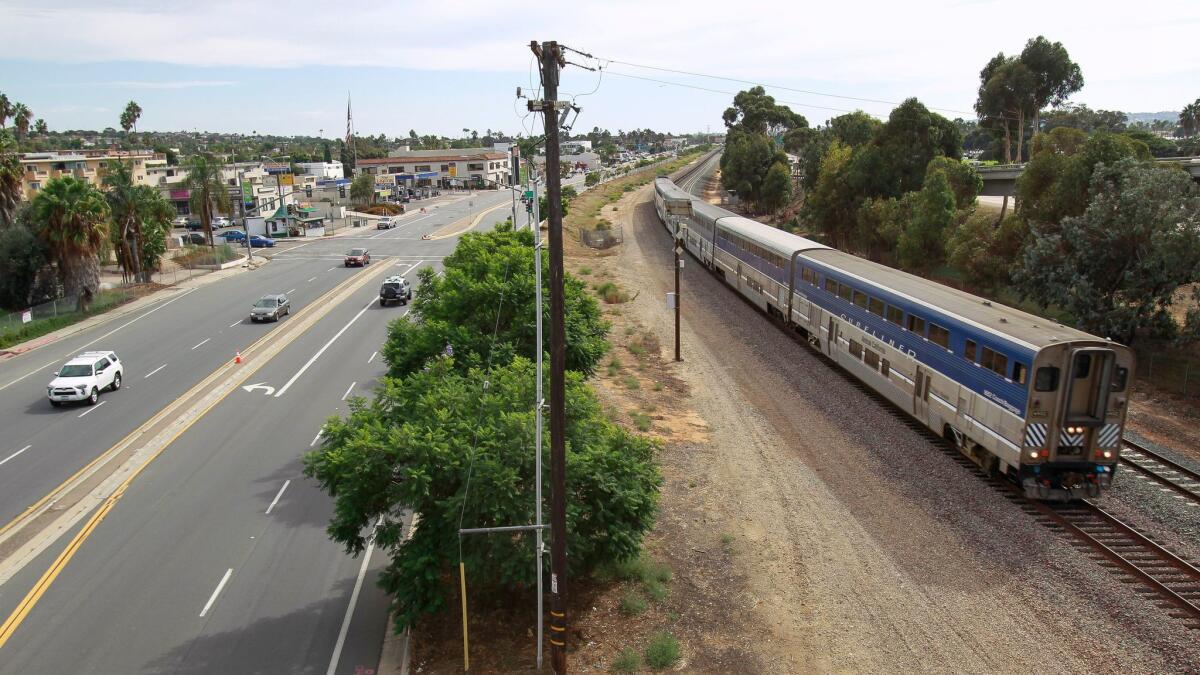 A train moved north on Sept. 27, 2016 past the site of the future Clairemont Drive Station for the trolley extension. (Hayne Palmour IV / Union-Tribune)