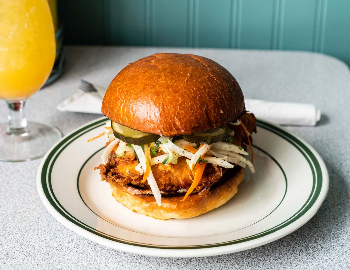 Royale’s Chicken Sandwich: Grilled or fried chicken with jicama-cilantro slaw, pickles and spicy mayonnaise on a brioche bun