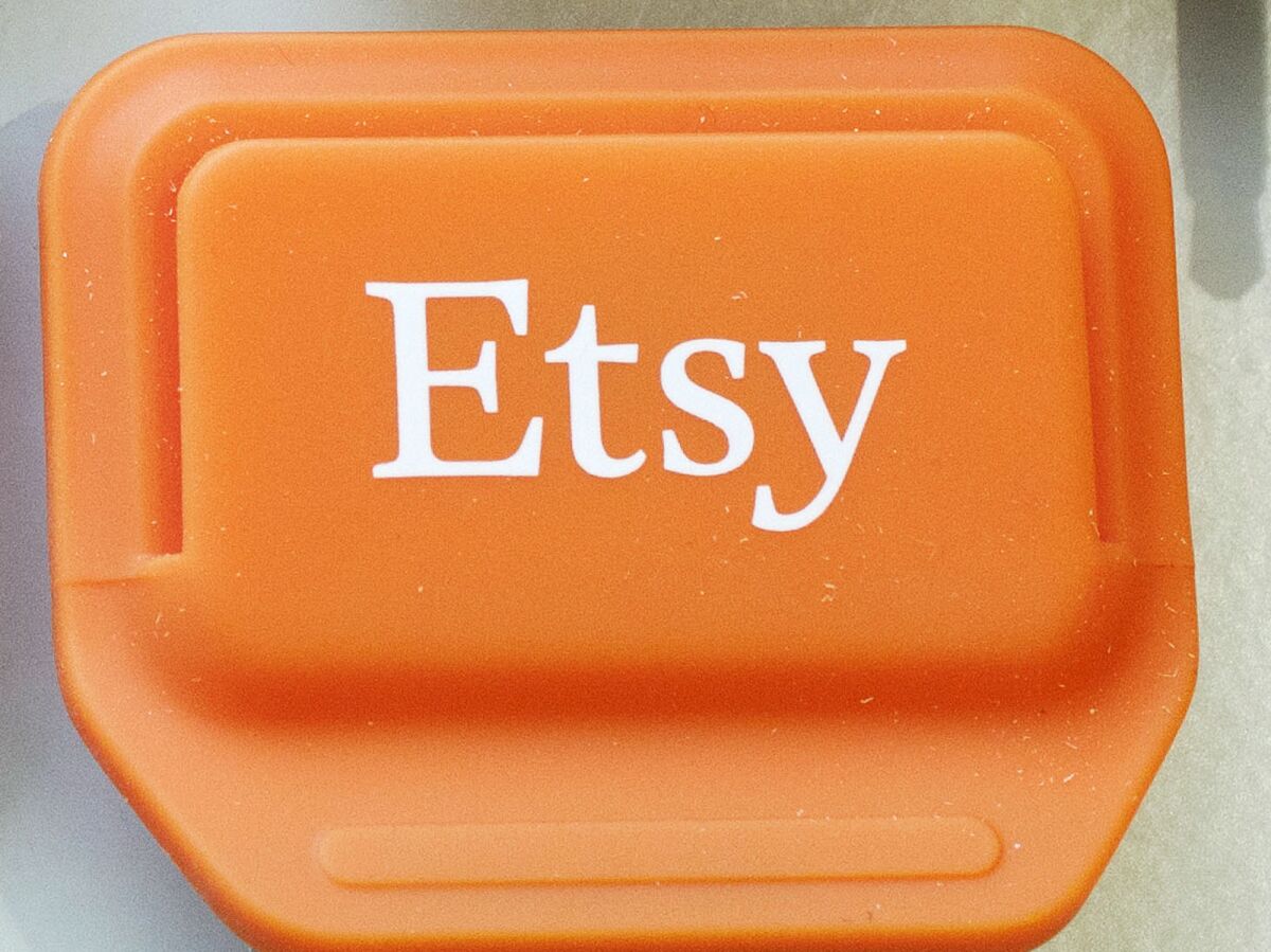 FILE - This Jan. 6, 2015 file photo shows an Etsy mobile credit card reader, in New York. Etsy said Wednesday, June 2, 2021, that it will buy Depop, an app that’s popular among young people looking to buy and sell used clothing and vintage fashions from the early 2000s. (AP Photo/Mark Lennihan, File)