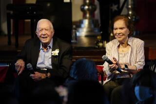 FILE- Former President Jimmy Carter and his wife former First Lady Rosalynn Carter sit together during a reception to celebrate their 75th anniversary Saturday, July 10, 2021, in Plains, Ga. In the year since Jimmy Carter first entered home hospice care, the 39th president has celebrated his 99th birthday, enjoyed tributes to his legacy and outlived his wife of 77 years. Rosalynn Carter, who died in November 2023 after suffering from dementia, spent just a few days under hospice. (AP Photo/John Bazemore, Pool, File)