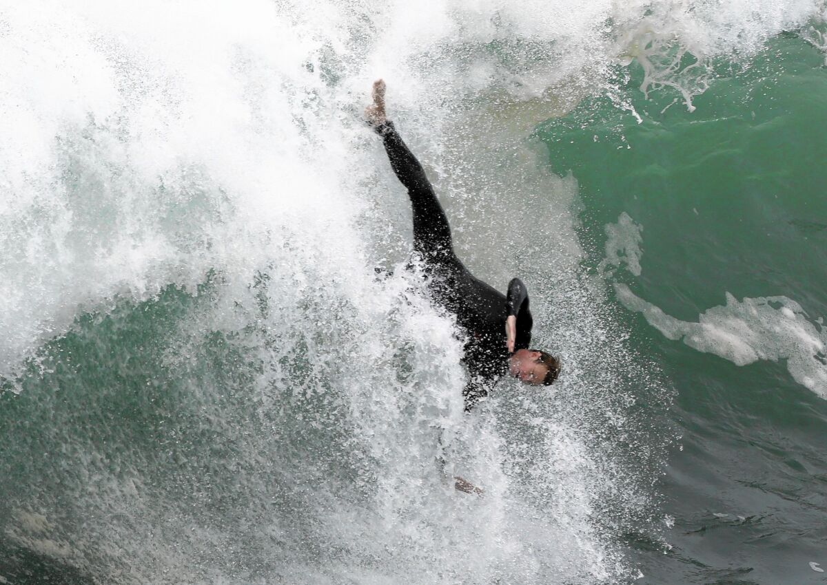 High surf at the Wedge in Newport Beach holds allure for surfers and dreamers alike.
