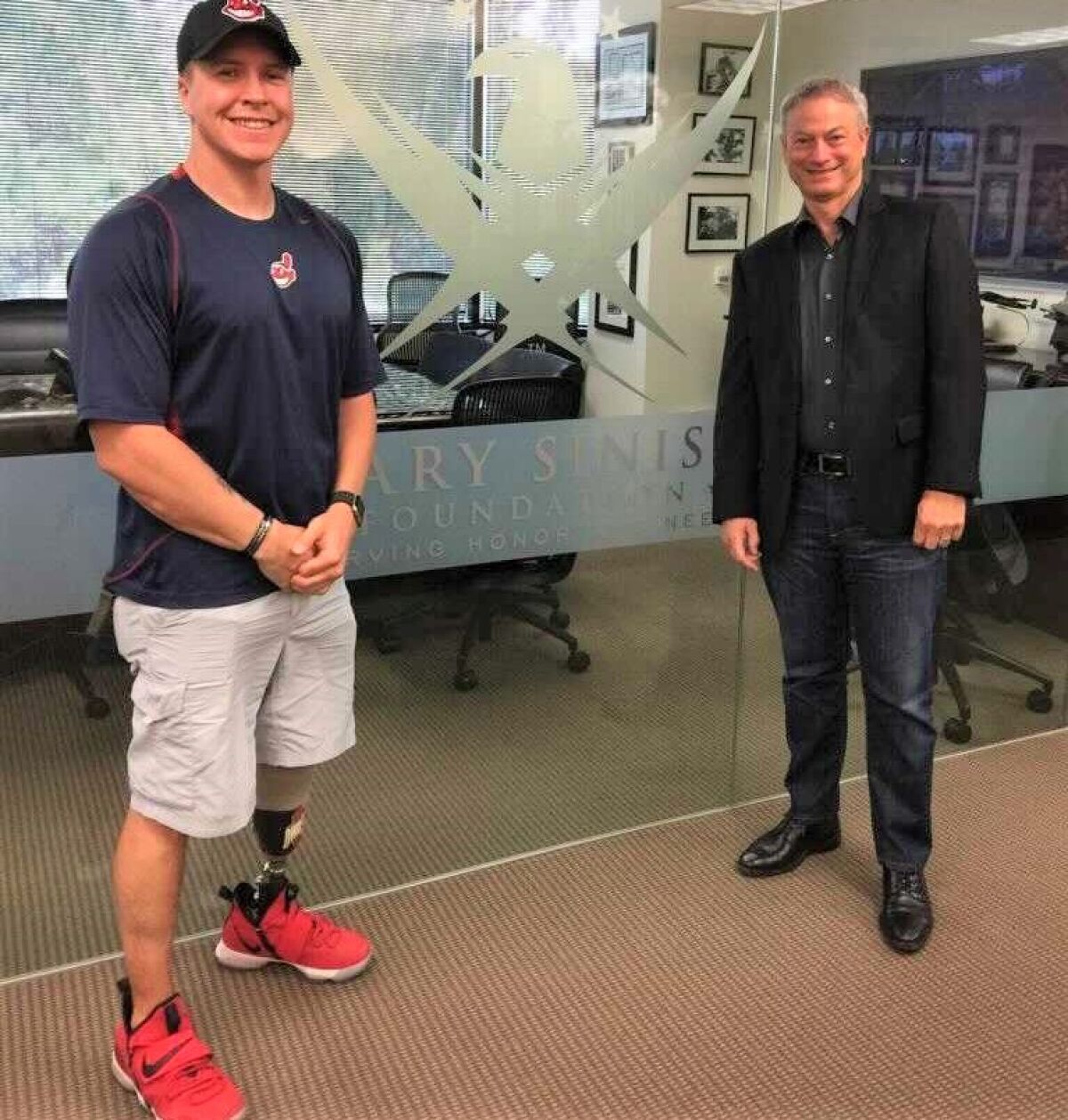 Daniel "Doc" Jacobs, retired Navy combat vet, is with Gary Sinise, whose foundation has built Jacobs an adapted smart house.