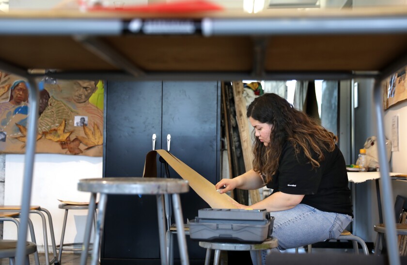 Antonia Sanchez works on an art project in her art class at UCLA