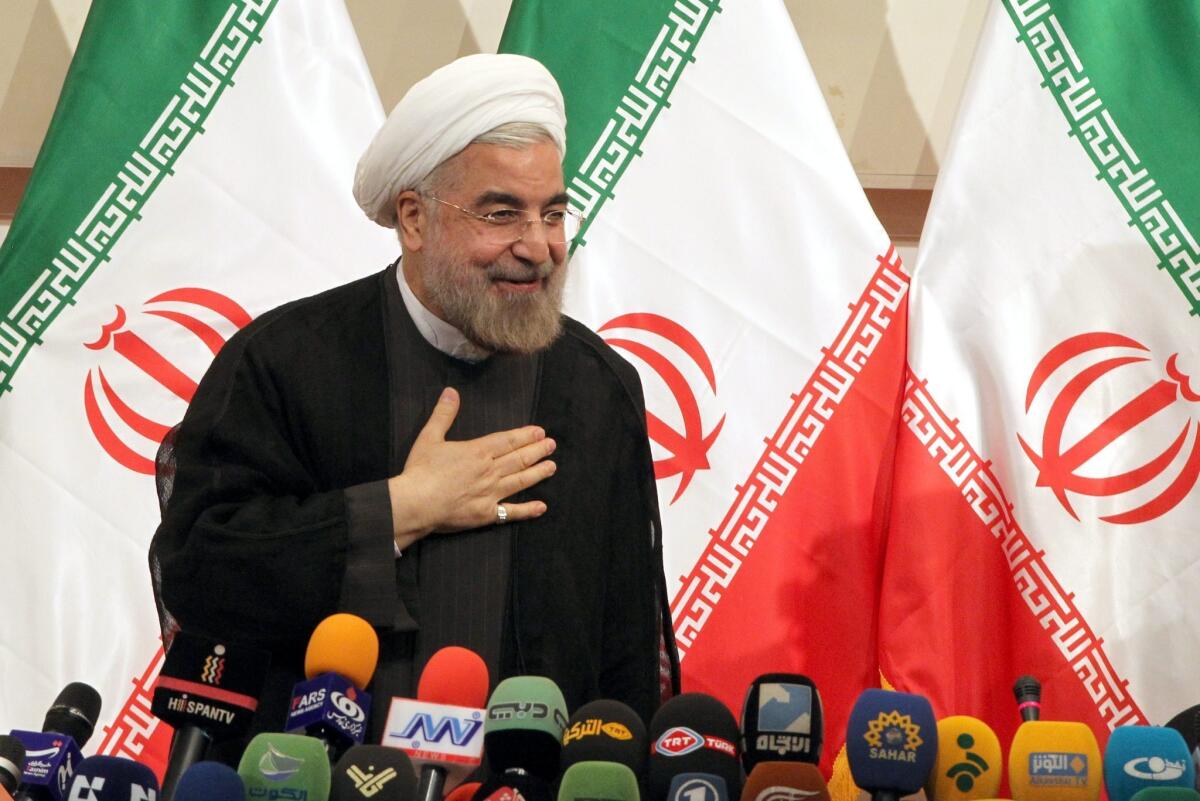 The Iranian people's election of the moderate Hassan Rowhani is baffling to those who believe he's at odds with the nation's supreme leader, Ayatollah Ali Khamenei, and the ultra-conservative establishment. Above: Iranian President-elect Rowhani greets reporters during a press conference in Tehran, Iran.