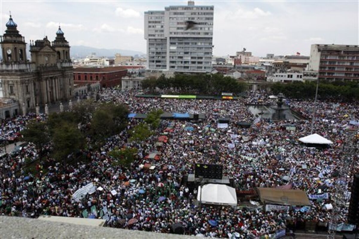 Supporters of Guatemala's President Alvaro Colom gather at the main Constitution Plaza in Guatemala City, Sunday, May 17, 2009. Sympathizers and opponents of Alvaro Colom staged demonstrations in Guatemala City on Sunday over accusations that Colom ordered a lawyer killed, a scandal threatening the rule of the country's first leftist leader in more than 50 years. (AP Photo/Moises Castillo)