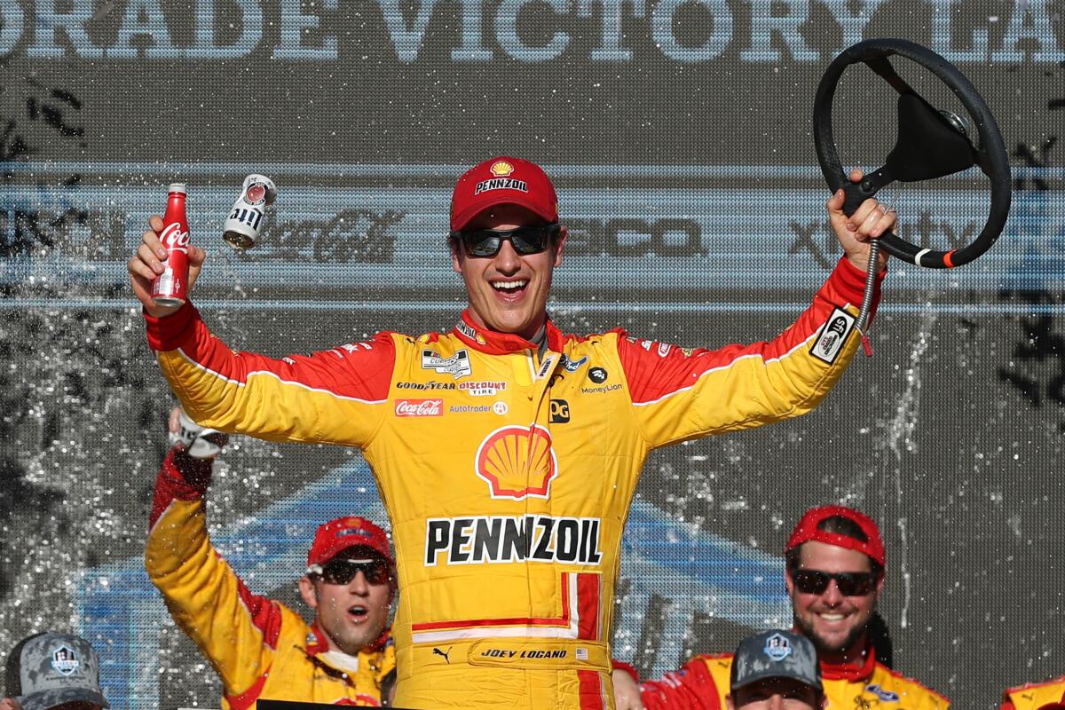 NASCAR driver Joey Logano celebrates in victory lane after winning Sunday's race at Phoenix Raceway.