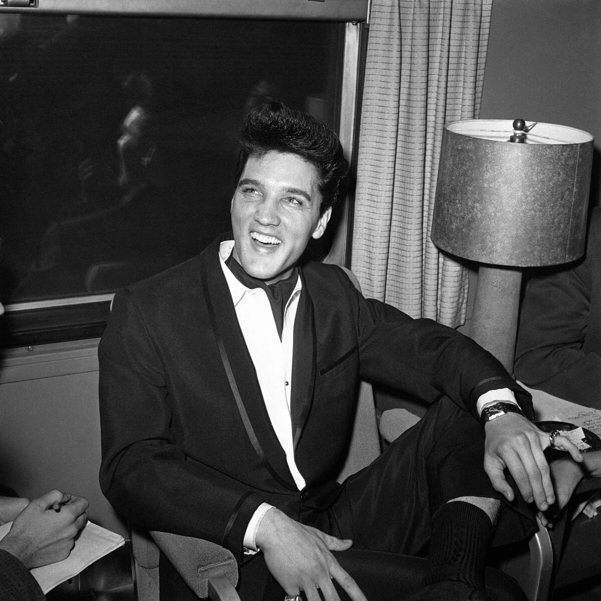 Singer Elvis Presley smiles 