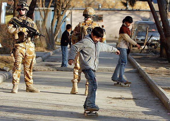 Afghan kids skateboard near their homes alongside British members of the NATO-led force in Kabul, Afghanistan. After decades of war, many Afghan children are in dire need of recreational outlets. Australian skateboarder Oliver Percovich plans to open the country's first skateboarding school  Skateistan  this spring. The project is growing in popularity and now has the support of Afghan authorities, as well as the German Foreign Ministry, which has donated $70,000.