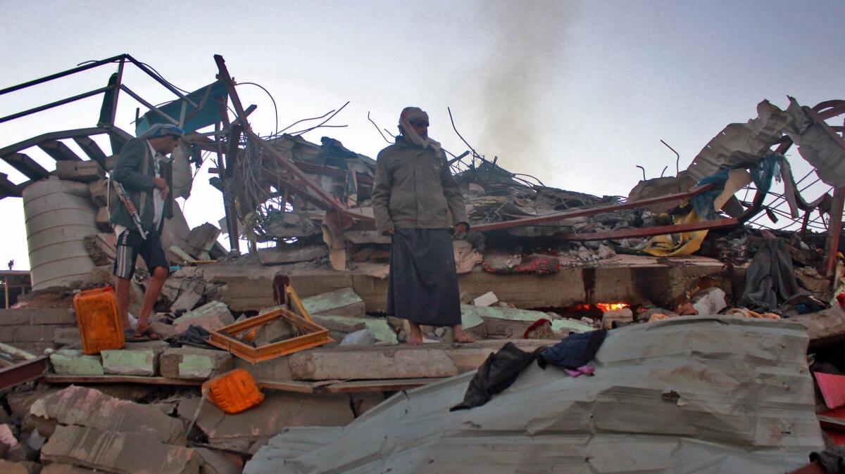 Yemenis check the aftermath of an airstrike in the northern governorate of Saada on Nov. 1.