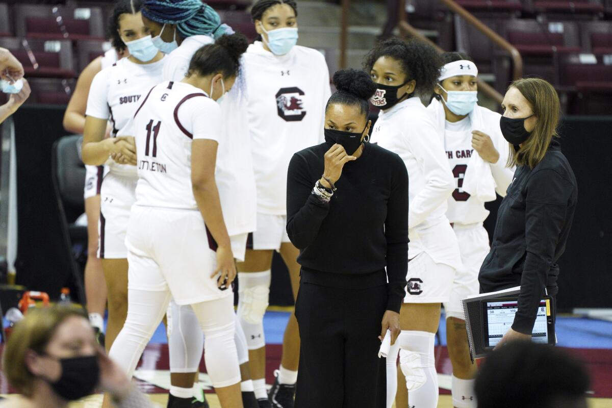 South Carolina coach Dawn Staley and assistant coaches Lisa Boyer