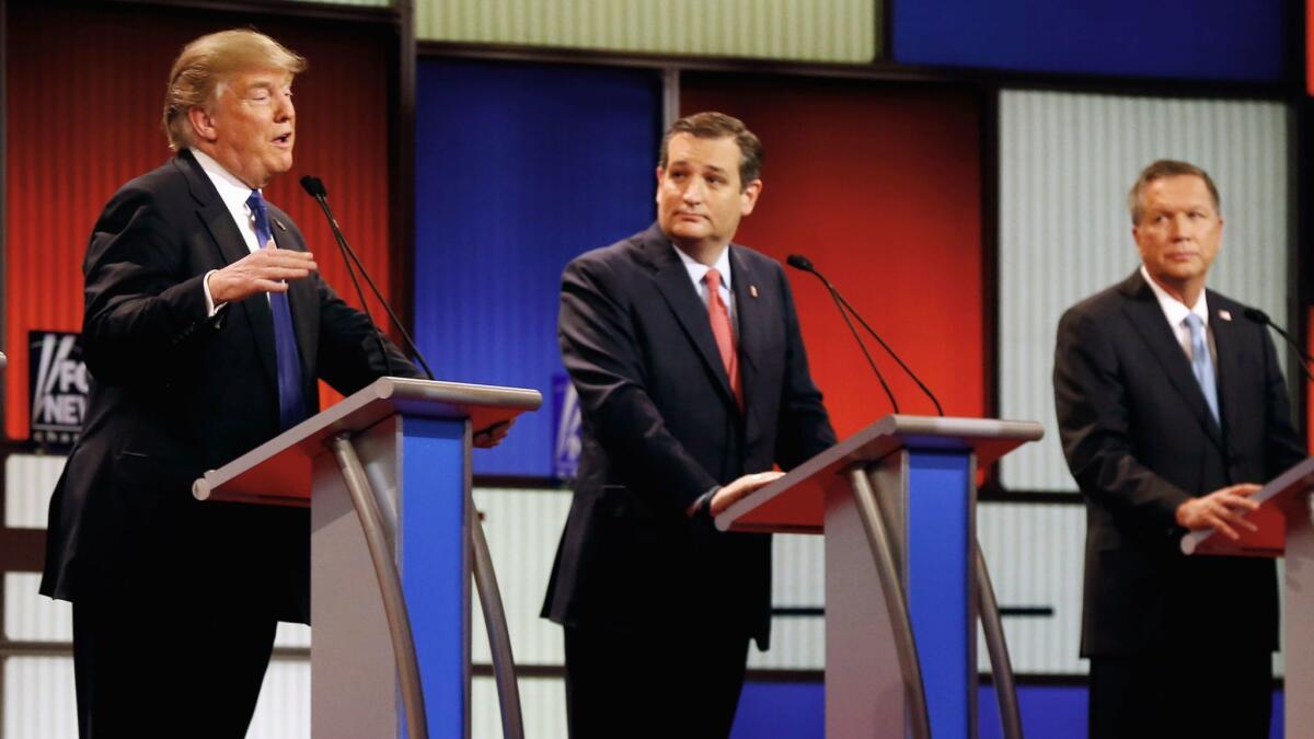 Republican presidential candidates, from left, Donald Trump, Sen. Ted Cruz and Ohio Gov. John Kasich appear during a Republican presidential primary debate at the Fox Theatre in Detroit on March 3, 2016.