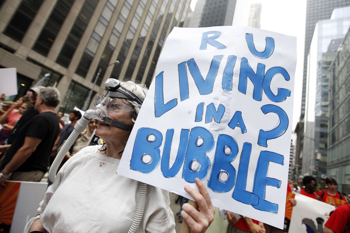 Demonstrators make their way down Sixth Avenue in New York during the People's Climate March on Sept. 21, 2014.
