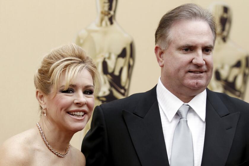 Leighe Ann Tuohy and Sean Tuohy arrive at the 82nd Academy Awards