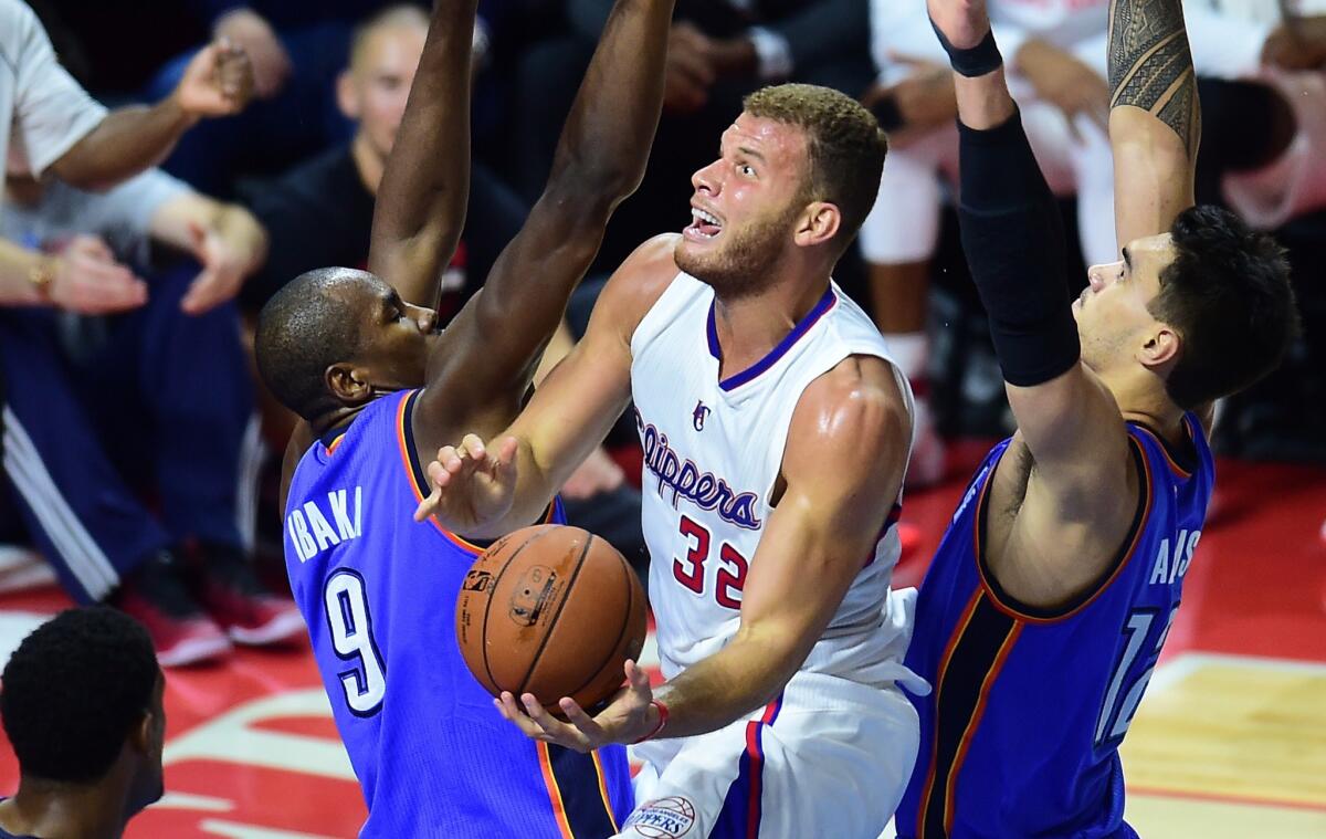 Blake Griffin drives to the basket under pressure from Oklahoma City's Serge Ibaka, left, and Steven Adams on Thursday night.