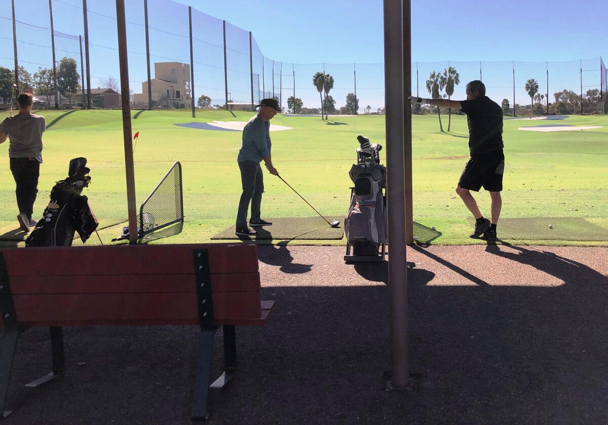 Golfers practice their swings at the Newport Beach Golf Course driving range. If Drive Shack brings its concept there, it would replace this range with three floors of hitting bays with augmented-reality play, dining, lounges and an outdoor pavilion.