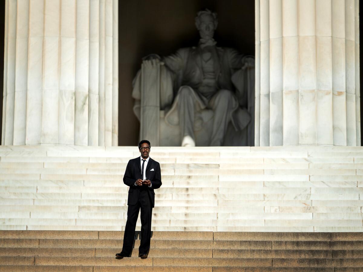 A man stands alone on the steps of the Lincoln Memorial in "Rustin."
