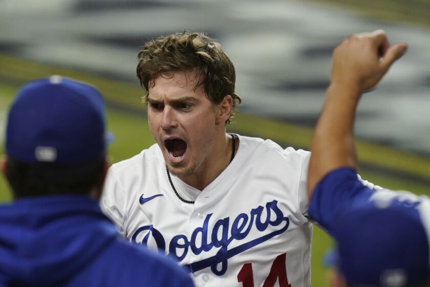 Los Angeles Dodgers' Enrique Hernandez celebrates his home run against the Atlanta Braves during the sixth inning in Game 7 of a baseball National League Championship Series Sunday, Oct. 18, 2020, in Arlington, Texas. (AP Photo/Eric Gay)