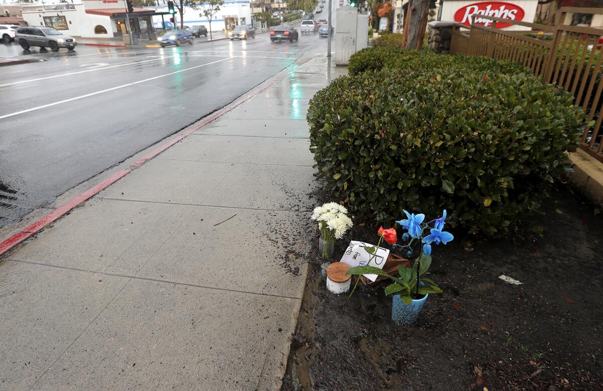A small memorial set up near where Xueyuan Zhang, 39, died early Saturday morning after being struck by a vehicle.
