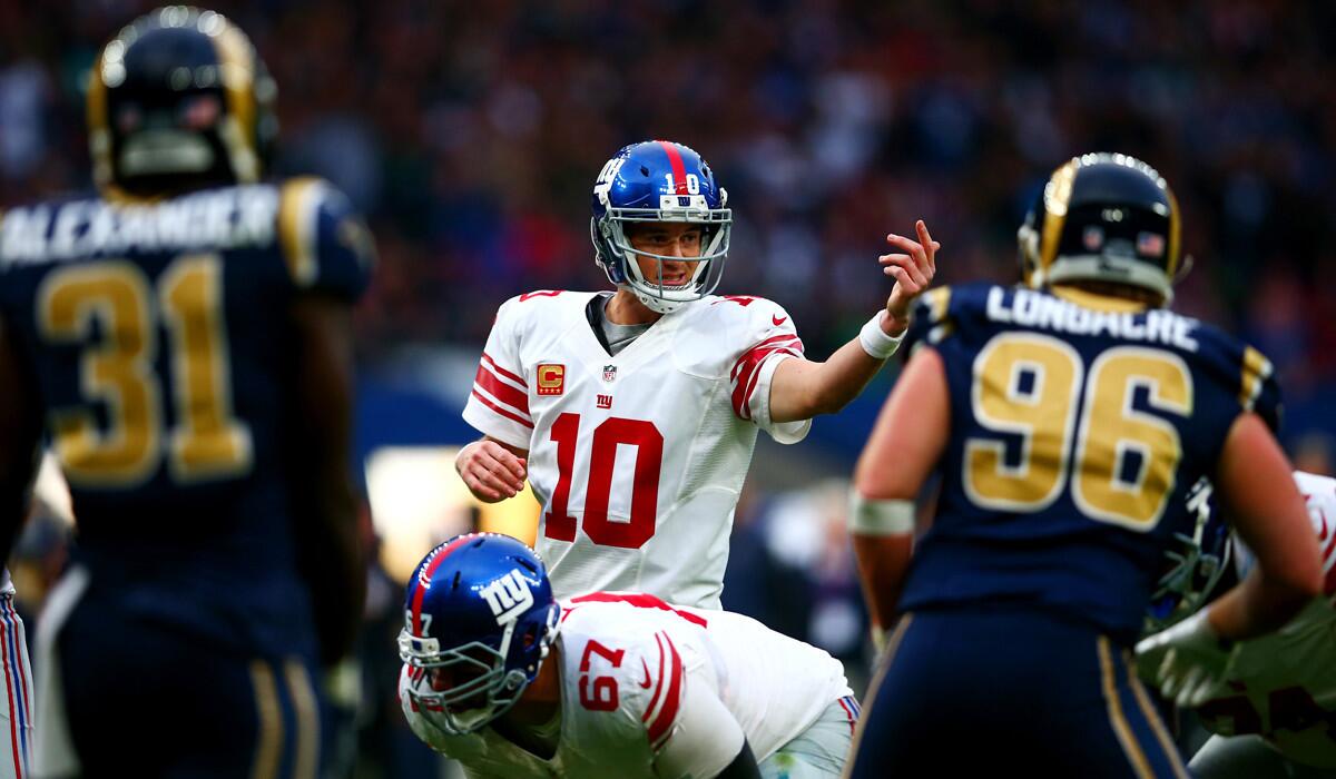 Quarterback Eli Manning (10) signals his teammates during the NFL International series game between the Giants and Rams in London on Sunday.