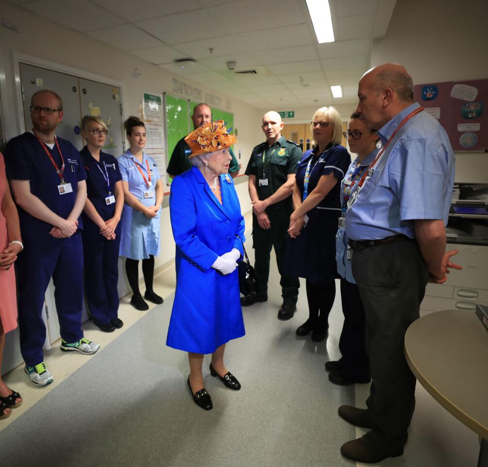 Queen Elizabeth II meets medical staff during a visit to the Royal Manchester Children's Hospital on May 25, 2017. The queen visited the hospital to meet victims of the Manchester Arena terror attack and to thank members of staff who treated them.