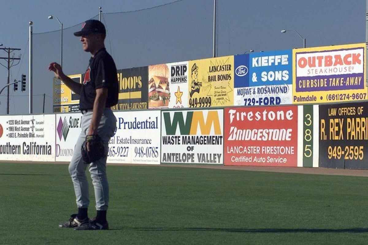 Advertisements add a touch of color to the outfield walls at the JetHawks' stadium in Lancaster