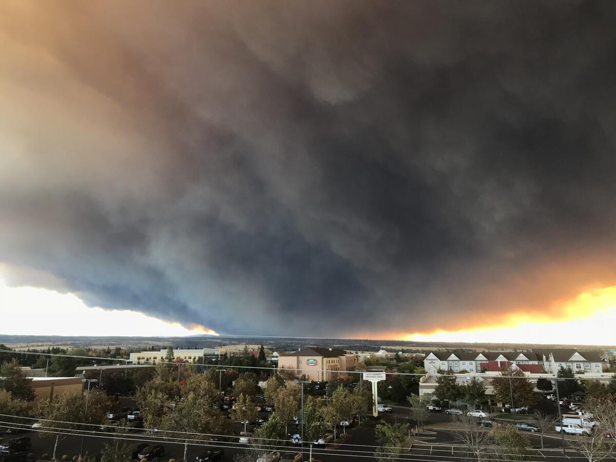 A massive plume of smoke from the Camp fire, burning in Feather River Canyon near Paradise, Calif.