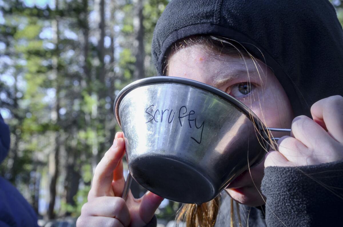 Kami Decker, 16, of Los Gatos, eats breakfast at camp. Her cowboy name: Scruffy.